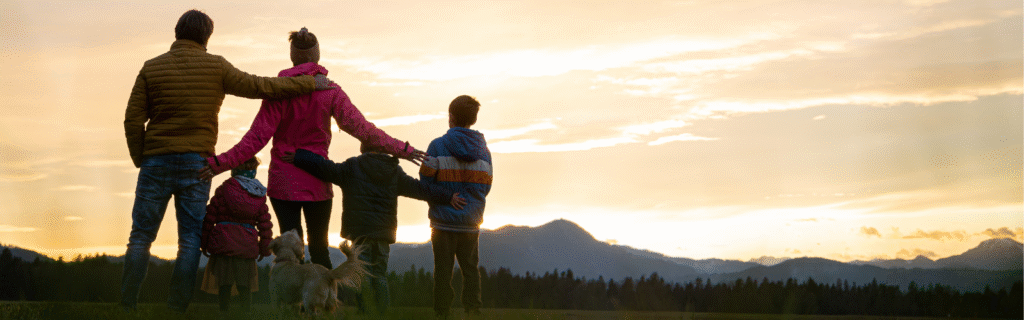 Family watching the sunset