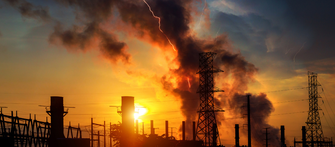 Plant buildings with smoke coming from the towers