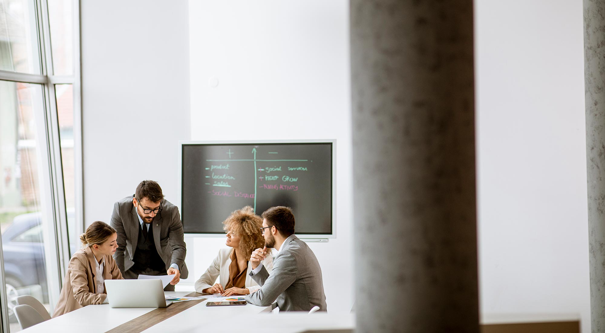 A group of people at a table discussing a project